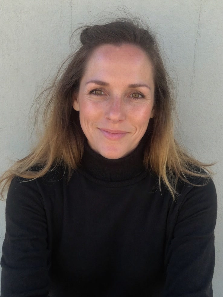 Erin Jean, marital connection coach, standing on a tree-lined path